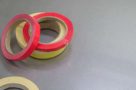 Several rollers of adhesive tape for different purposes. Paint and duct tape. Selective focus.の写真素材