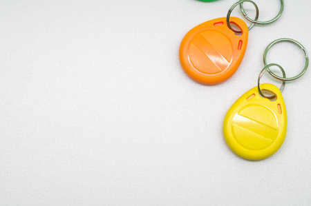 Magnetic key for the door intercom. Multicolored programmable chip keys. Copy space, selective focusの写真素材