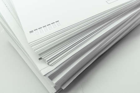 A stack of large white postal envelopes. Packaging for letters and documents. Postal supplies. Selective focusの写真素材