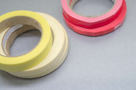 Several rollers of adhesive tape for different purposes. Paint and duct tape. Selective focus.の写真素材