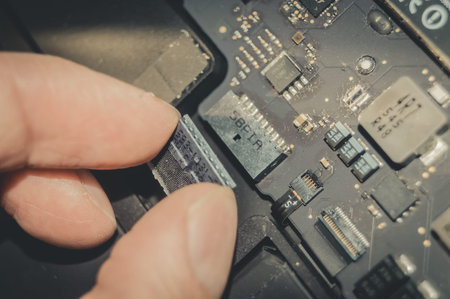 The process of connecting the battery connector to the laptop motherboard. Service and repair of the...