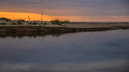 Sunset in river Gauja mouthの写真素材