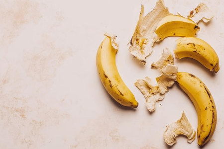 peeled bananas lie on a surface with a simple diet and healthy eatingの素材