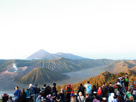 Tourists enjoy views of the valley of Mount Bromo at sunrise, in East Java, Indonesiaのeditorial素材