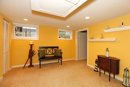 Yellow room in the basement with bench.の写真素材