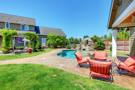 American Country farm luxury house with porch and beautiful flowers.