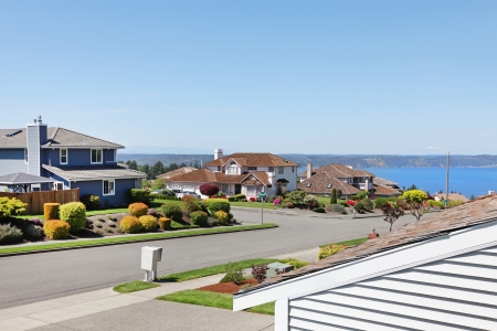 Large houses on the street with water view. American NorthWest.の写真素材