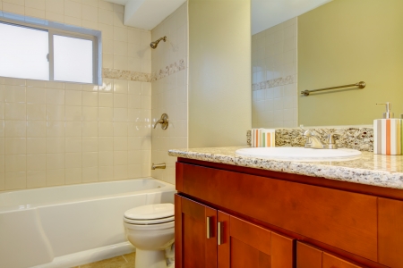 New bathroom interior with cherry sink cabinet ad white tub の写真素材