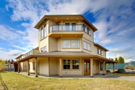 Large New luxury home exterior with balconies, three floors.の写真素材