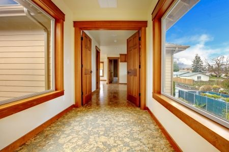 Large hallway in empty house with cork floor. New luxury home interior.の写真素材