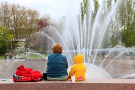 SEATTLE CENTER INTERNATIONAL FOUNTAIN during spring with woman and child.の写真素材
