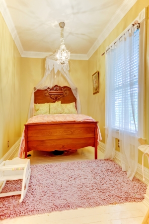 Bedroom interior with antique bed and white floor.の写真素材