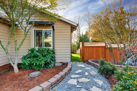 House exterior with stone walkway and bushes