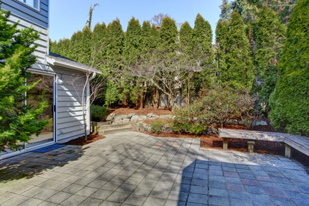 House backyard with tile floor walkout deck and landscape