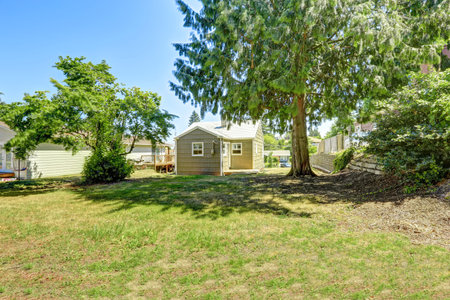 Clapboard sidinig house with spacious backyard. Real estate in  Washington state