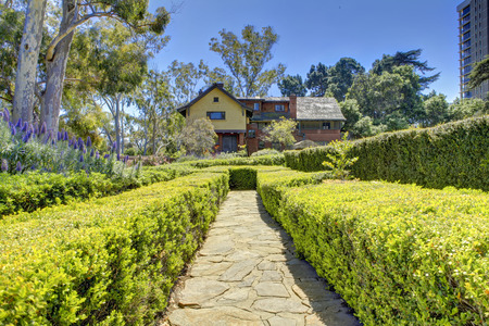 Picturesque walkway with trimmed hedges to Marston House Museum & Gardens. San Diego, CAのeditorial素材