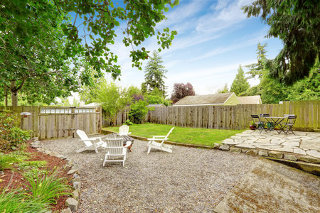 Cozy backyard patio area with black and white table sets