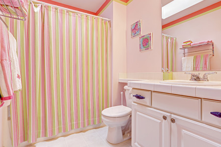 Light pink bathroom interior with striped curtainsの写真素材