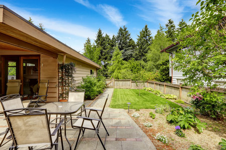 Backyard with walkout patio area and landscape design