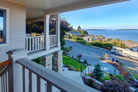 House with wraparound walkout deck. View of puget sound and driveway, Tacoma, WAの写真素材