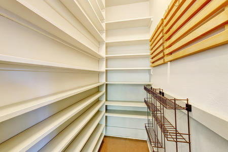Empty shelves in a home pantry with tile floor. Northwest, USAの写真素材
