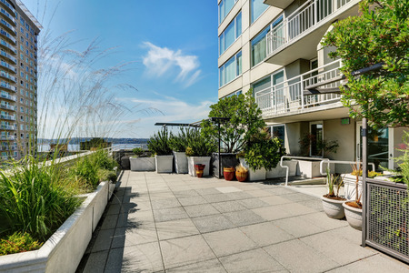 Terrace of city apartment with lots of greenery on sunny summer day in Seattle, Northwest, USAの写真素材