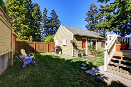 Backyard view of craftsman house with a shed and patio area. Northwest, USAの写真素材