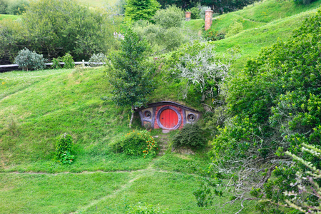 MATAMATA, NEW ZEALAND - JANUARY 15, 2015: Hobbiton - movie set created for filming the Lord of the Rings. View of hobbit house.のeditorial素材