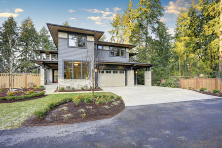 Luxury new construction home with blue siding and natural stone wall trim. Northwest, USA