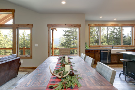Dining table decorated for Christmas in a luxury American country house.の写真素材