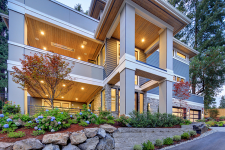 Modern house exterior with high ceiling entrance porch and perfectly designed landscape.の写真素材
