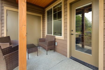 Amazing balcony patio with fire pit and forest and mountains view. Dream come true home exterior. New American architecture. Comfortable and beautiful home details.の写真素材