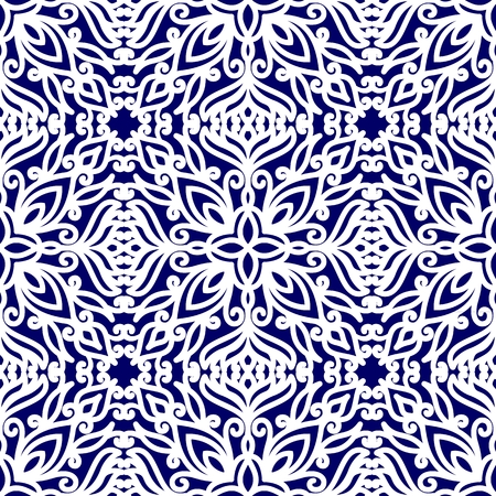 Seamless pattern with ethnic ornaments with curls. White floral pattern on a blue background. Vector illustrationのイラスト素材
