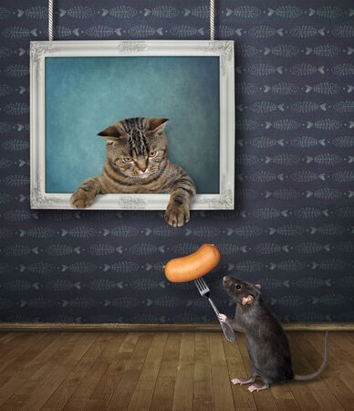 The beige cat is coming out from the picture hanging on the wall of the art gallery. A black rat gives him a sausage on a fork.の写真素材
