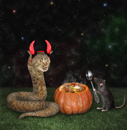 A cat snake in red devil horns and a rat with a spoon are near a pumpkin in the meadow for...