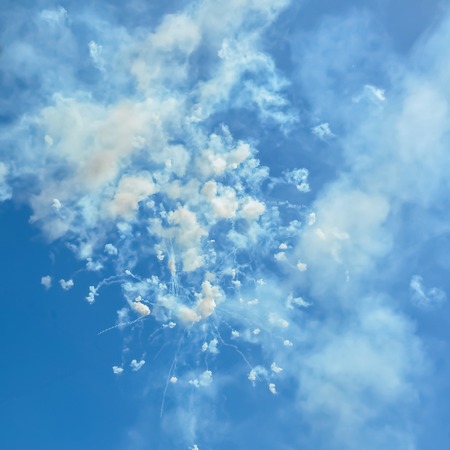 Fireworks and smoke in the blue sky in day time Ischia Italyの写真素材