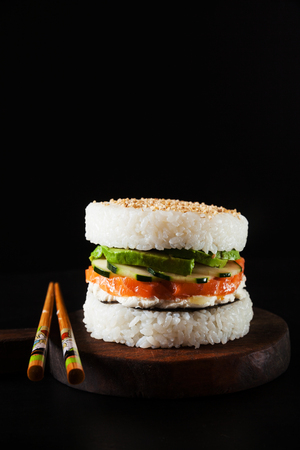 japanese food with burger made from rice and smoked salmon, avocado, light cheese and noriの写真素材