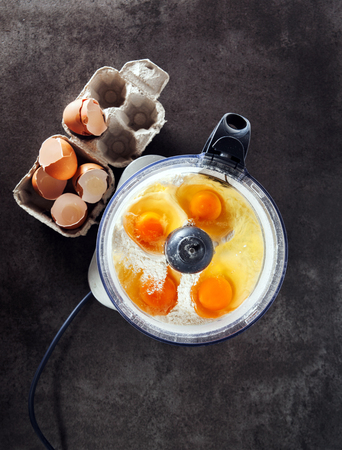 Prepare the Dough from the eggs  in food processor on grey stoneの写真素材