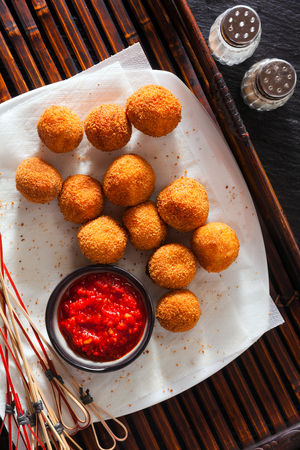 Traditional italian fried balls of mozzarella with spicy souce. figher food の写真素材