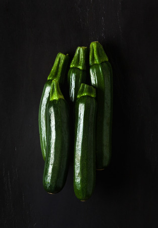 Zucchini isolated on blackの写真素材