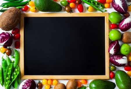 slate board for writing as copy space and different vegetables and fruits background. summer harvest