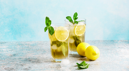  iced green tea with lemon and fresh mint .Copy spaceの写真素材