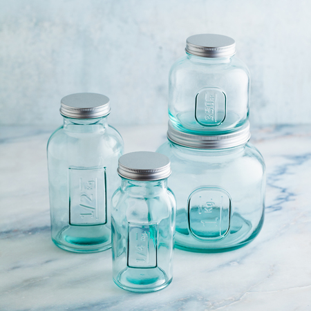Glass jars, ready for sterilization and canning. preservation of food on a marble table.の写真素材
