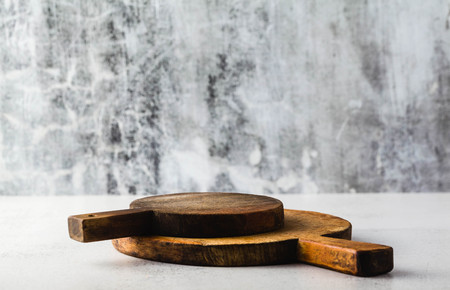Empty food background from wooden boards and gray backdrop. Place for promotional products, frame for food. Copy spaceの写真素材