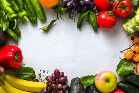 Fresh vegetables and fruits on a white kitchen table. Background for supermarkets, fresh food stores, delivery.の写真素材