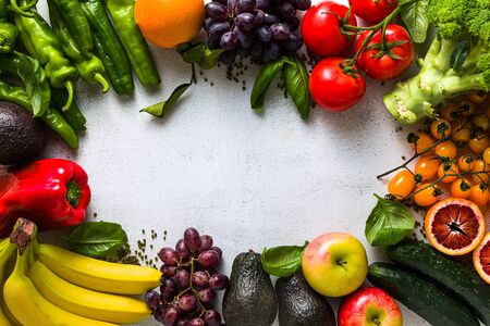 Fresh vegetables and fruits on a white kitchen table. Background for supermarkets, fresh food stores, delivery.の写真素材
