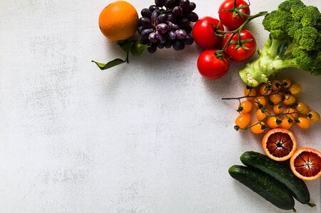 Fresh vegetables and fruits on a white kitchen table. Background for supermarkets, fresh food stores, delivery.の写真素材