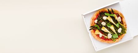 banner of Vegan pizza asparagus in a box for delivery, advertising or menuの写真素材