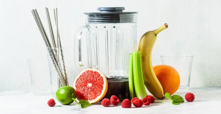 banner of Empty glass smoothie blender bowl and ingredients on the table. Not disposable metal tubes. Healthly food.の写真素材