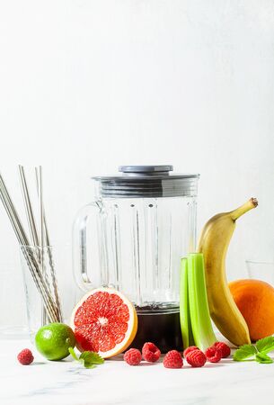 Empty glass smoothie blender bowl and ingredients on the table. Not disposable metal tubes. Healthly food.の写真素材